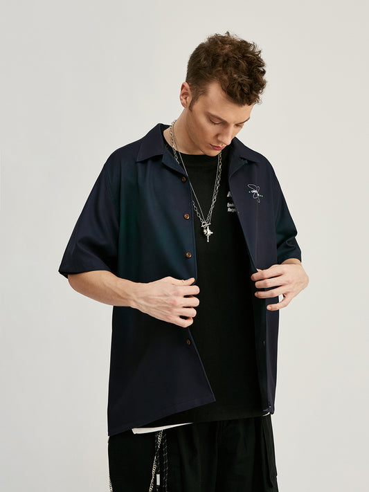 Chemise à manches courtes pour homme, ample, imprimée avec des lettres de rue, style streetwear.