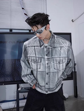 Veste en jean déconstruite à épaules rembourrées et enduites