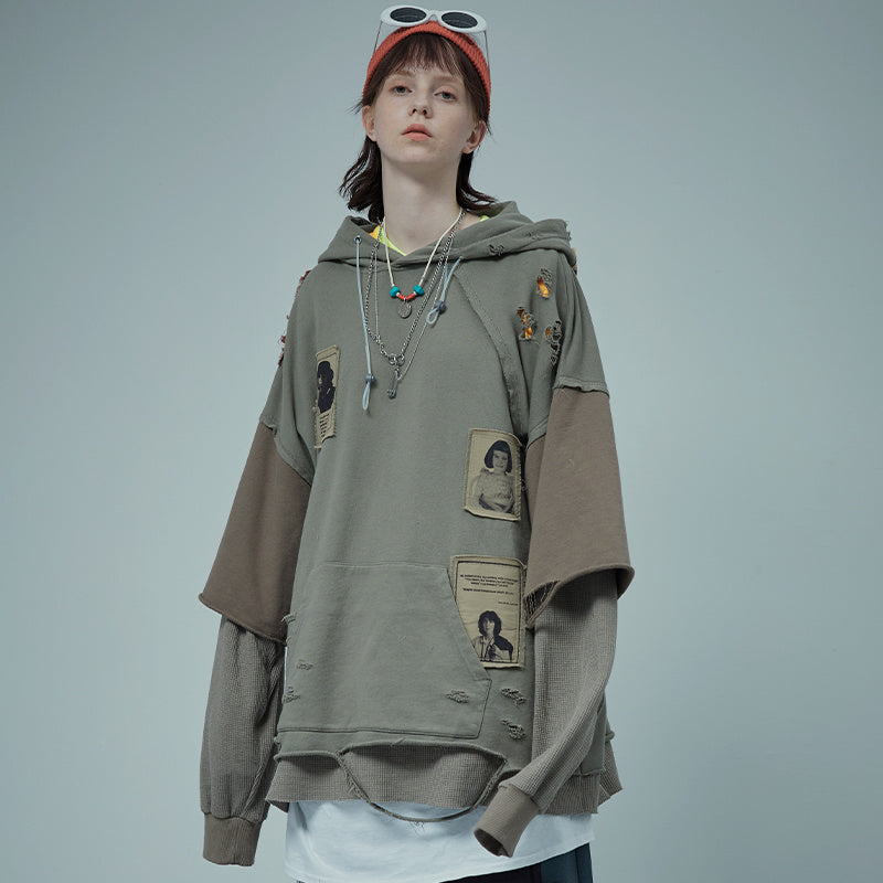 Cucitura di due finte toppe di distruzione del maglione