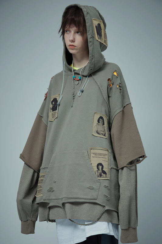 Cucitura di due finte toppe di distruzione del maglione