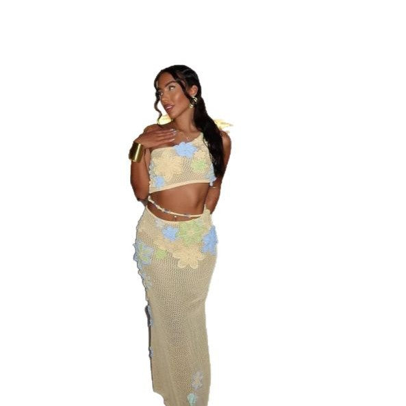 Ensemble élégant en tricot creux sans manches avec haut à épaules obliques et robe mi-longue