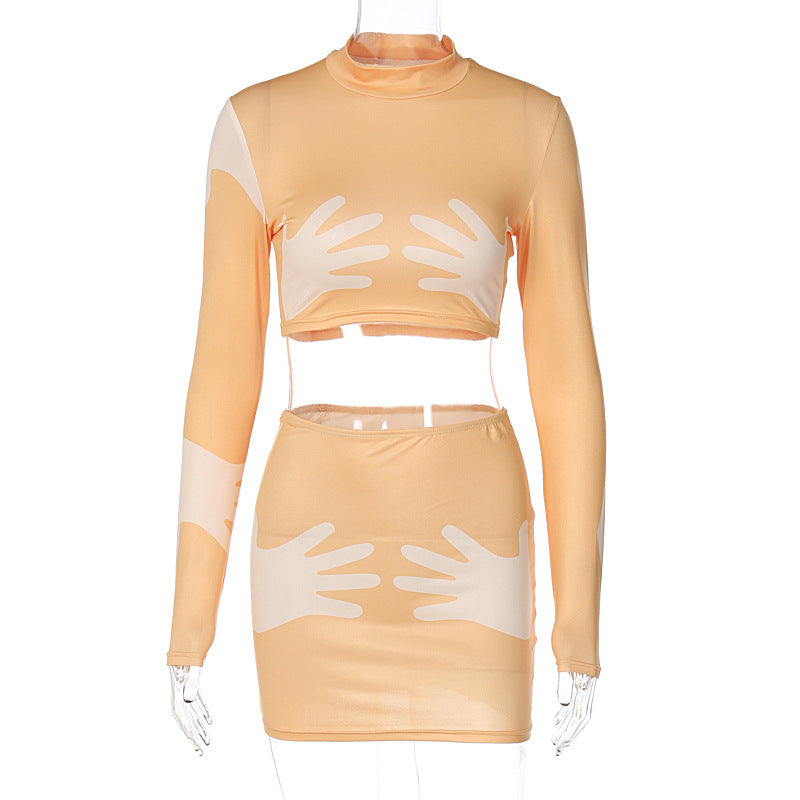 Completo gonna corto e aderente con stampa alla moda, a maniche lunghe e crop top