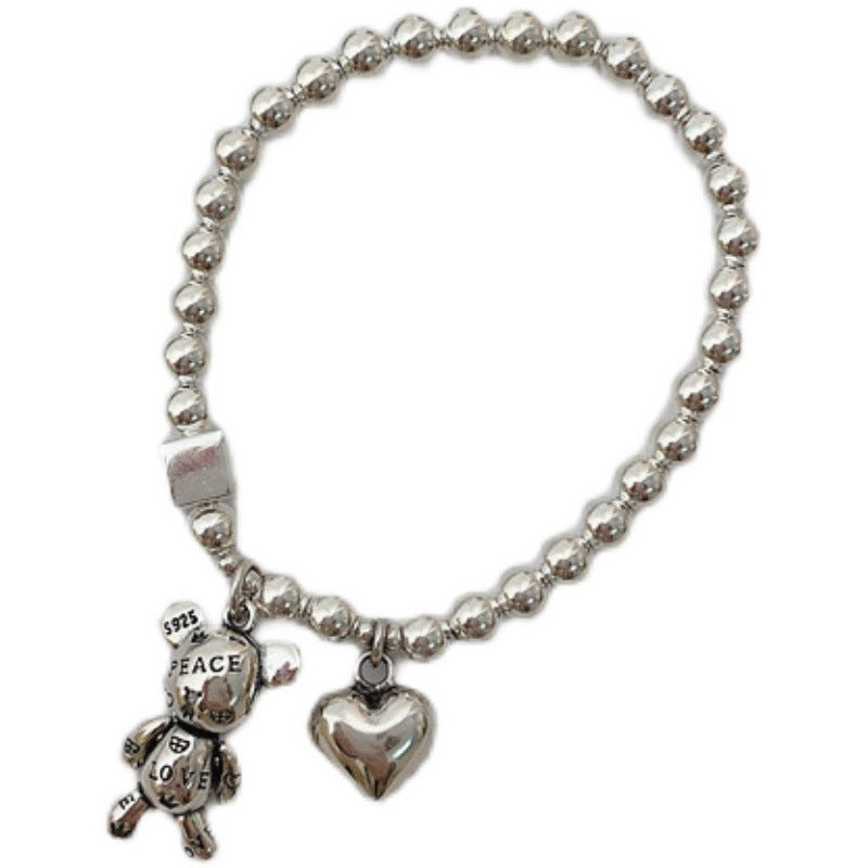 Bracciale con orsetto e lettera, stile retrò